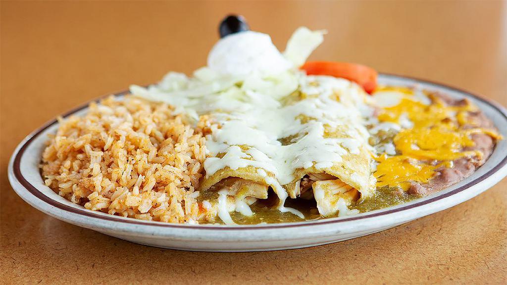 Enchiladas Suizas · Chicken enchiladas in green sauce, topped with jack cheese & sour cream.