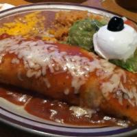 Steak Picado Burrito · Served with rice beans guacamole and sour cream.