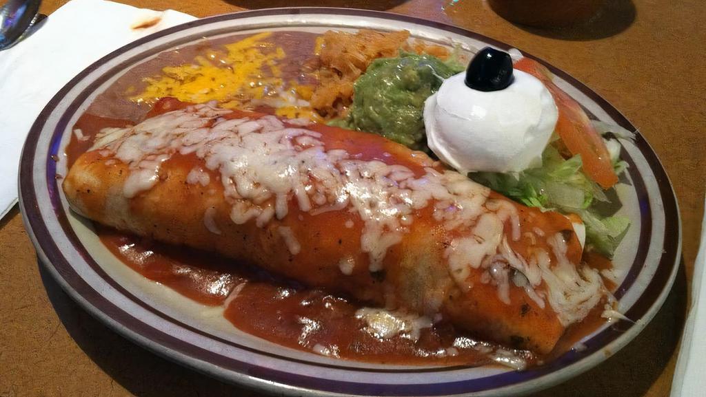 Steak Picado Burrito · Served with rice beans guacamole and sour cream.