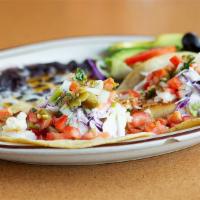 Baja Fish Tacos · Served with Rice & Beans.