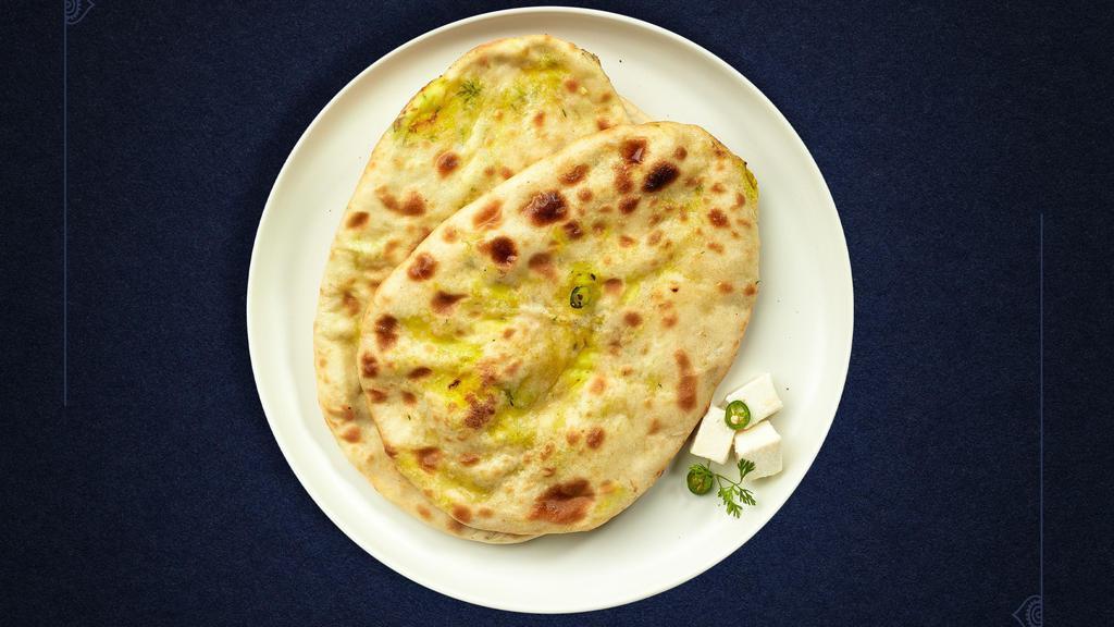 Paneer Paradise Naan · Freshly baked bread stuffed with minced paneer cooked in a clay oven.