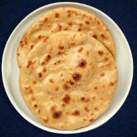 Tandoori Bender Roti · Whole wheat flat bread baked in an Indian clay oven.