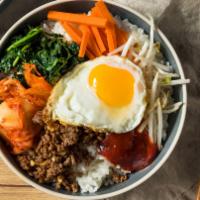 Bibimbap · Bean sprout, carrot, mushroom, and other vegetables served over rice. Topped with a fried eg...