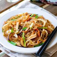 Jap Chae Bokkum · Sauteed Korean clear yam noodles with beef, mushroom, julienne carrot, onion, and sesame oil.