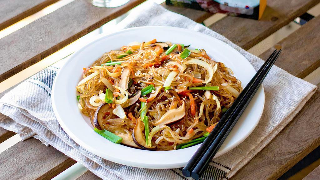 Jap Chae Bokkum · Sauteed Korean clear yam noodles with beef, mushroom, julienne carrot, onion, and sesame oil.