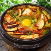 Soft Tofu Stew · Vegetarian and spicy. Soft tofu stew with beef, oyster, mushroom, zucchini, and onion, serve...