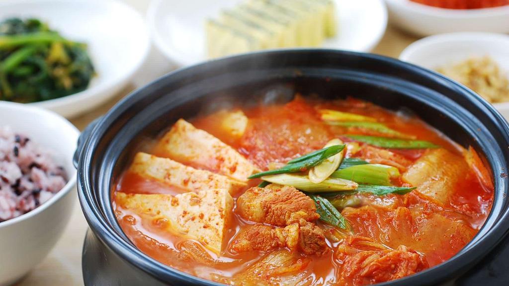 Kimchi Stew with Pork meat · Spicy Kimchi stew with tofu, onion, sliced kimchi, and pork meat.