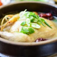 Ginseng Chicken Soup · Korean Ginseng chicken soup with whole chicken, sticky rice, dried dates, garlic, and ginger...