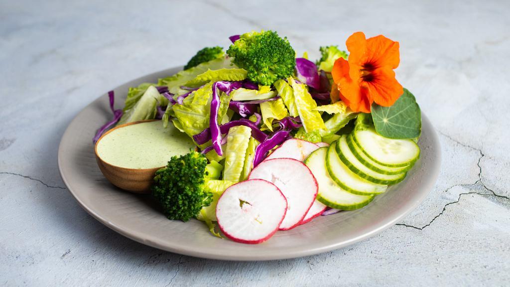 Crunchy Romaine Salad · Romaine, red cabbage, broccoli, cucumber, radish, cilantro, jalapeño cilantro dressing.