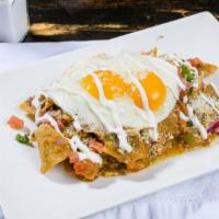 Chilaquiles (Verdes) · Corn tortilla chips tossed in choice of salsa, chorizo, sour cream , quest fresco and pico d...