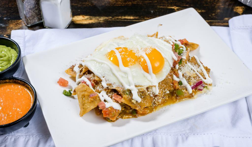 Chilaquiles (Verdes) · Corn tortilla chips tossed in choice of salsa, chorizo, sour cream , quest fresco and pico de gallo served w/ two eggs any style