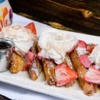 Tres Leches Frech Toast · Thick Brioche, topped w/ tres leches cream, choice of strawberries or banana.