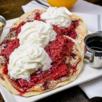 Raspberry cheesecake pancakes(2) · Signature buttermilk pancakes filled with cheesecake bites and raspberries. topped with powd...