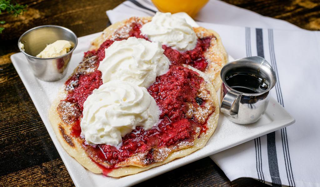 Raspberry cheesecake pancakes(2) · Signature buttermilk pancakes filled with cheesecake bites and raspberries. topped with powdered sugar, raspberry compote and whipped cream
