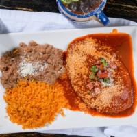 Chile Relleno · Green pasilla chilies filled with oaxaca cheese topped with a roasted tomato red salsa queso...