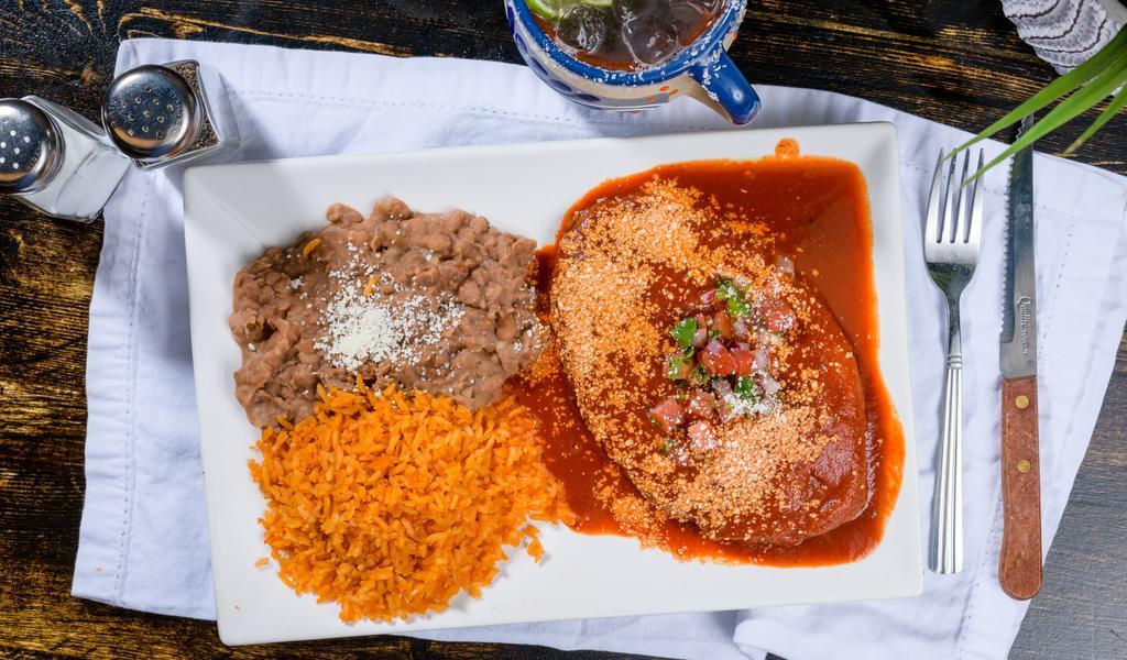 Chile Relleno · Green Pasilla chilies, filled with Queso Oaxaca, topped with a roasted tomato red salsa, Queso fresco, pico de gallo served with refried beans, rice, and your choice of flour and corn tortillas
