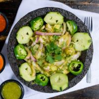 Aguachile Verde · Cured “raw” shrimp in a cucumber-habanero lime sauce, red onions, cilantro topped with avocado
