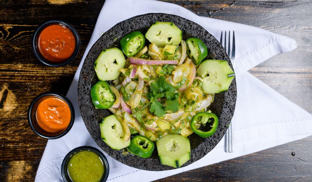 Aguachile Verde · Cured “raw” shrimp in a cucumber-habanero lime sauce, red onions, cilantro topped with avocado