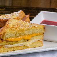 Monte Cristo Sandwich · Texas style french toast sandwich stuffed with sliced turkey, ham, american & jack cheese. S...