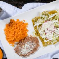 Enchiladas Verdes (3) · Filled with Pollo en tinga rolled in a corn tortilla, melted Jack cheese, topped with lettuc...