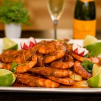 Botana Ranchera De camarón · Cajun style shrimp, corn, potatoes, longaniza