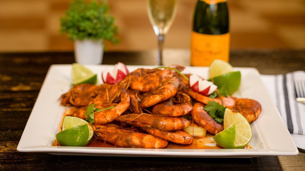 Botana Ranchera De camarón · Cajun style shrimp, corn, potatoes, longaniza