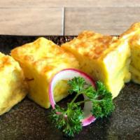 Atsuyaki Tamago · Japanese egg omelet which is made by rolling together several layers of cooked egg. (4pc)