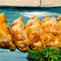 Vegetable Gyoza · Deep fried vegetable pot stickers. (6 Pieces )