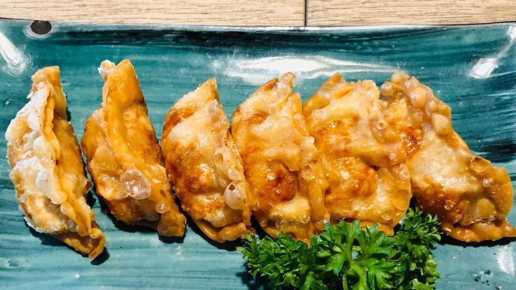 Vegetable Gyoza · Deep fried vegetable pot stickers. (6 Pieces )