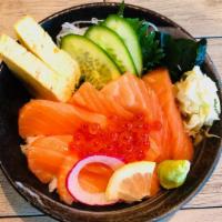 Salmon Ikura Don · Salmon sashimi and salmon roe over rice served with miso soup, salad.