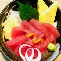 Tekka Don · Tuna sashimi over rice served with miso soup, salad.