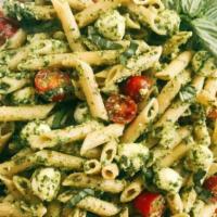 Creamy Pesto Pasta · Shrimp or chicken, mushrooms and spiral pasta are smothered in a delicious basil pesto sauce