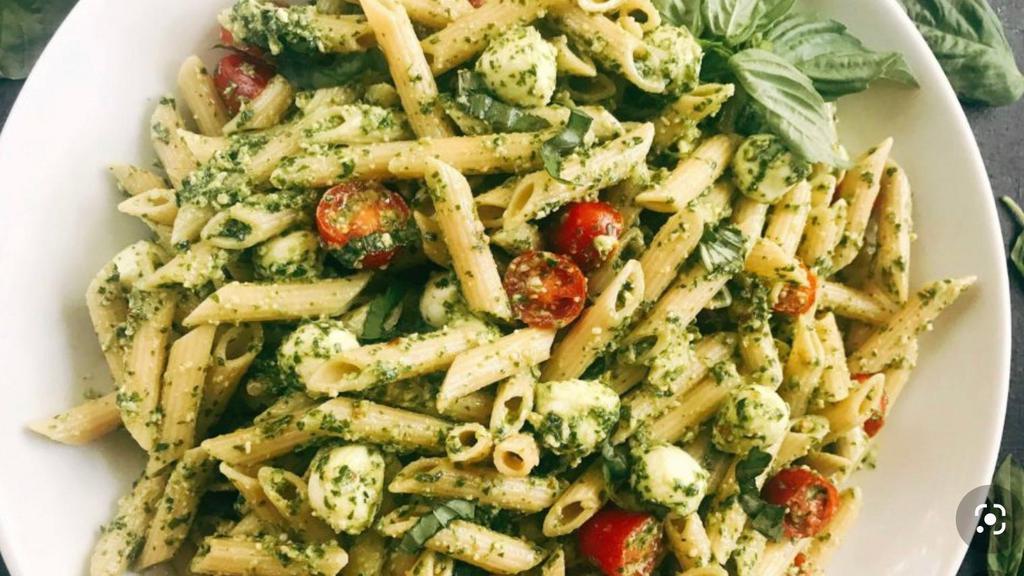 Creamy Pesto Pasta · Shrimp or chicken, mushrooms and spiral pasta are smothered in a delicious basil pesto sauce