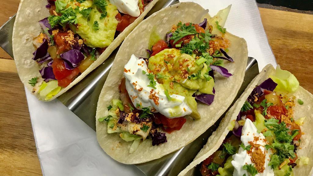 Tacos · Your choice of protein, 3 flour tortillas, shredded lettuce, red cabbage, salsa.  Side of guacamole and sour cream