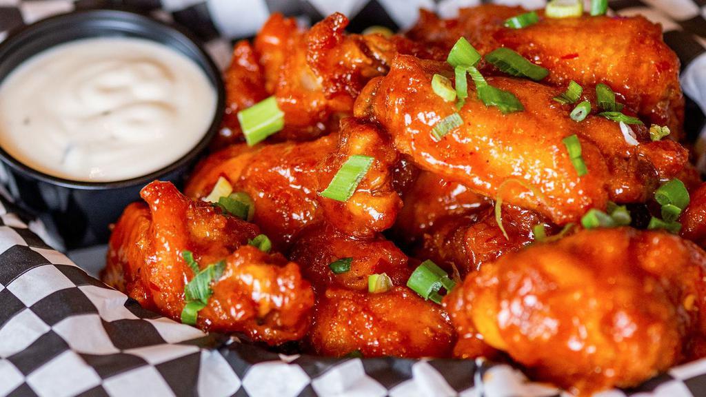 Chicken Wings · Chicken wings deep-fried and coated in a choice of any one sauces from buffalo hot wings, garlic parmesan,  teriyaki, mango habanero, and BBQ.