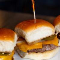 Slider Trio · Lamb or beef Angus patty charbroiled in low heat. Served with American cheese, grilled onion...