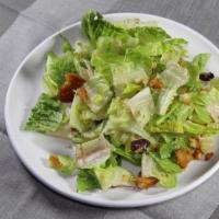 Caesar Salad · Green salad of Romaine lettuce and croutons dressed with lemon juice, olive oil, and parmesa...