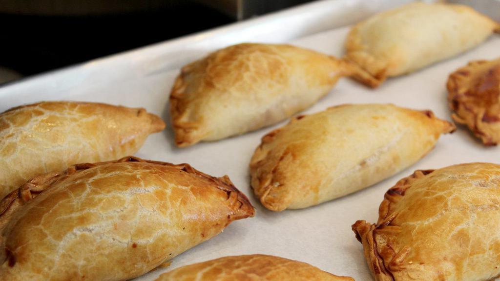 Carne - Beef · Argentinians love one thing above all else, beef. If you haven't had your quota of beef empanadas today, you better hurry. Stop by and fulfill your duty. Grass fed ground beef, red peppers, green olives, onions, hardboiled eggs and a blend of spices.