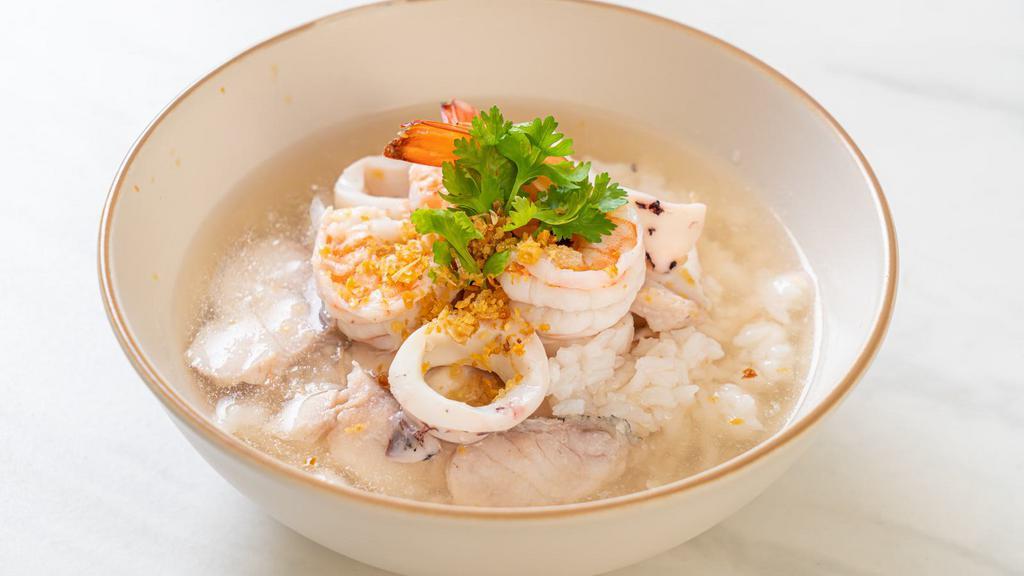 Sizzling Rice Soup · Yummy rice soup made with shrimp, chicken, snow pea and carrot.