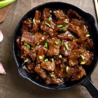 Mongolian Beef · Yummy Mongolian Beef with flank steak, scallions, and mixed vegetables.