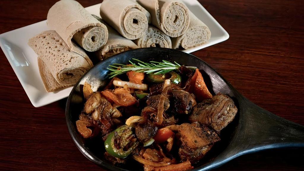 6.  Lamb Tibsy · Pan-roasted strips of lamb simmered with garlic, onions, butter and mild spices.