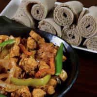 9.  Chicken Tibsy · Pan-roasted strips of chicken simmered with garlic, onions, butter and mild spices.