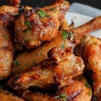 Wings · MARINATED CHICKEN WINGS, COOKED IN OVER THE WOOD FIRED OVEN