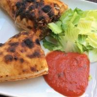 Chicken Calzone · Mozzarella Cheese,Parmesan,red onion tomatoes, Mushrooms, Green olives, olive oil with shred...