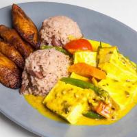 Coconut Curried Tofu · Served w/ Rice and Beans & Fried Plantains