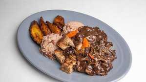 Jerk Pork & Beef Oxtails · Served w/ Rice and Beans & Fried Plantains