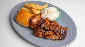 Family Pack- BBQ Boneless Pork · Serves up to 4 guests. Includes Rice and Beans & Fried Plantains.