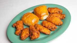 Fried Chicken Wings  · 8 pieces. Served w/ Bread Rolls
