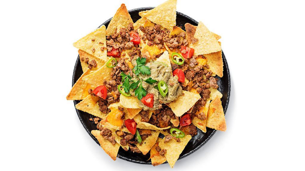 Mas Nachos · Hot & Crispy Mexican-style chips topped with a generous helping of cheese, guacamole, beans, mild sauce, sour cream and Salsa Fresca.