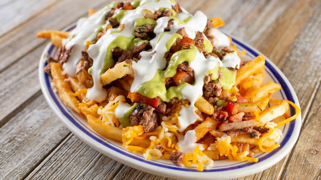 Carne Asada Fries · House Specialty! Classic fries with a generous helping of seasoned carne asada, onions, cilantro, and melted cheese.